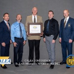 Grand Valley and CALEA officials pose with GVSU's CALEA law enforcement certificate.